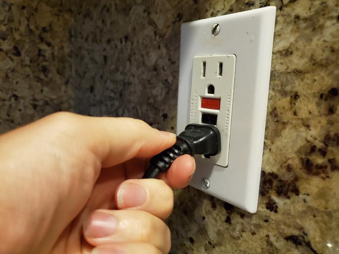 electrical contractor in PA testing newly installed outlets
